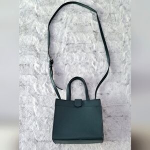 A New Day green cross-body snap closure purse..